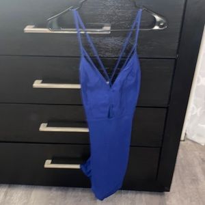 Royal blue dress. crosses in back. open diamond on stomach. adjustable straps.